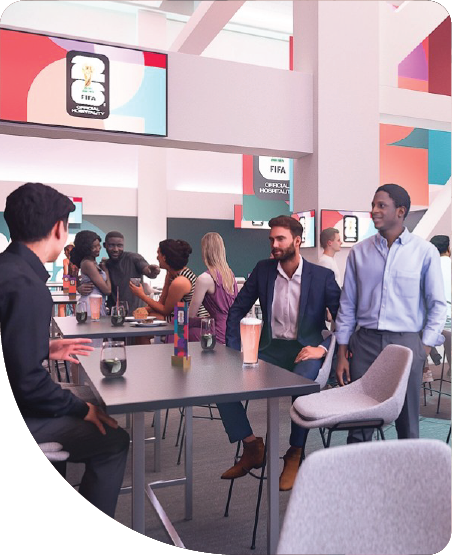 Guests socialising in a premium FIFA World Cup 2026 hospitality lounge with event branding.
